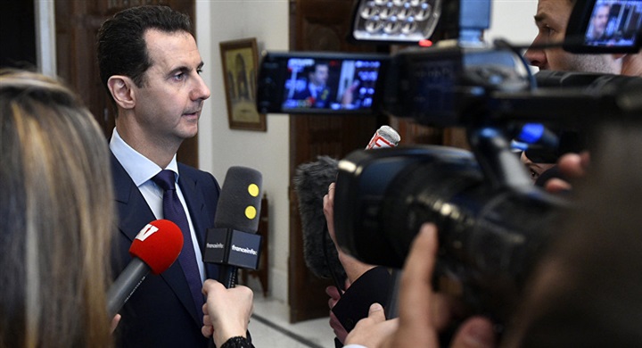 الرئيس الأسد يصف